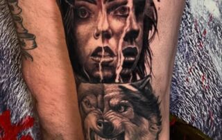 Realistic Tattoo am Unterschenkel mit Frauenportrait und Wolf Realistic Tattoo am Unterschenkel mit Frauenportrait und Wolf – Iron Ink Gevelsberg